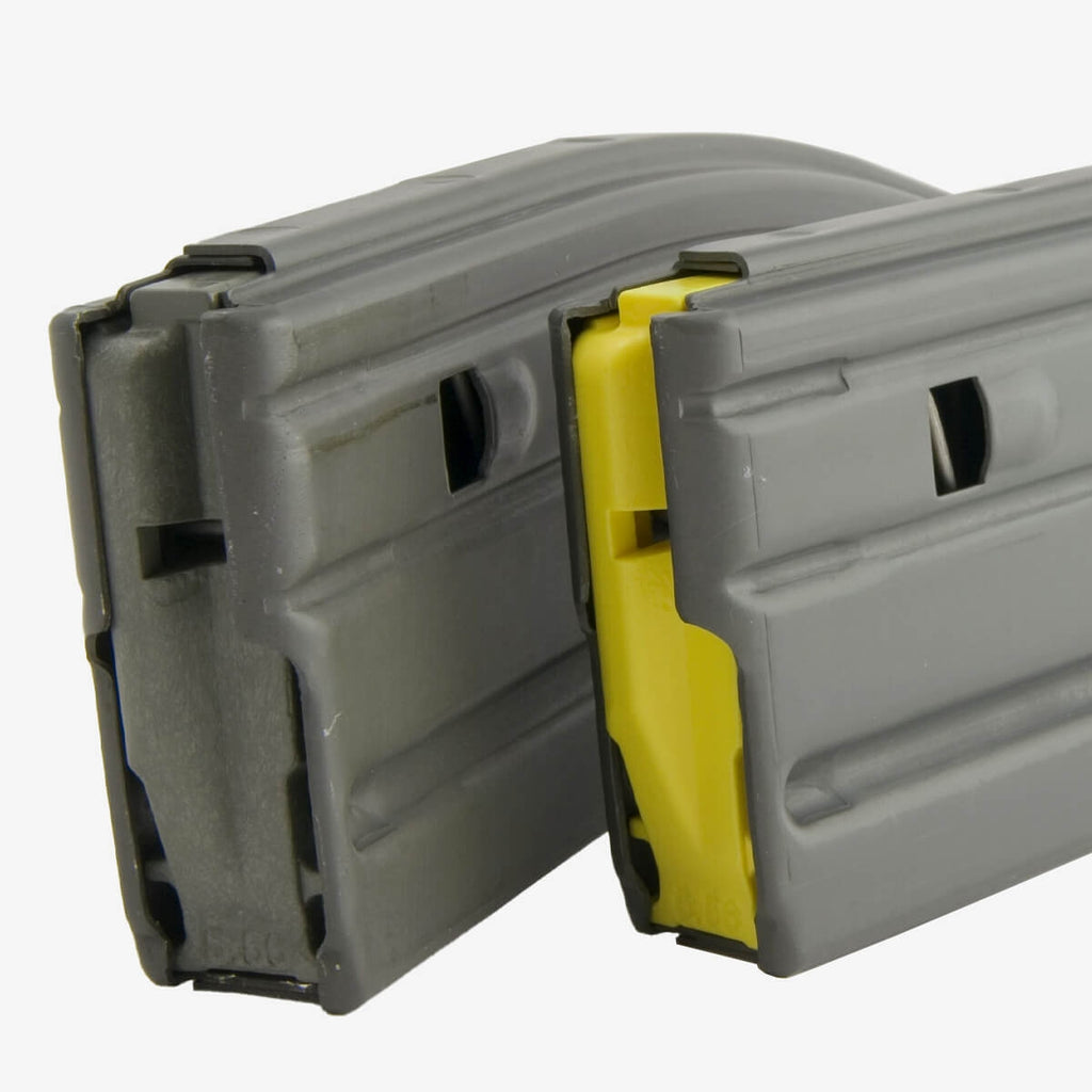 Two gray plastic modules with a yellow center on a white background