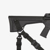 Black rifle with a sling on a white background