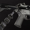 Close-up of a rifle with a sling on a black background