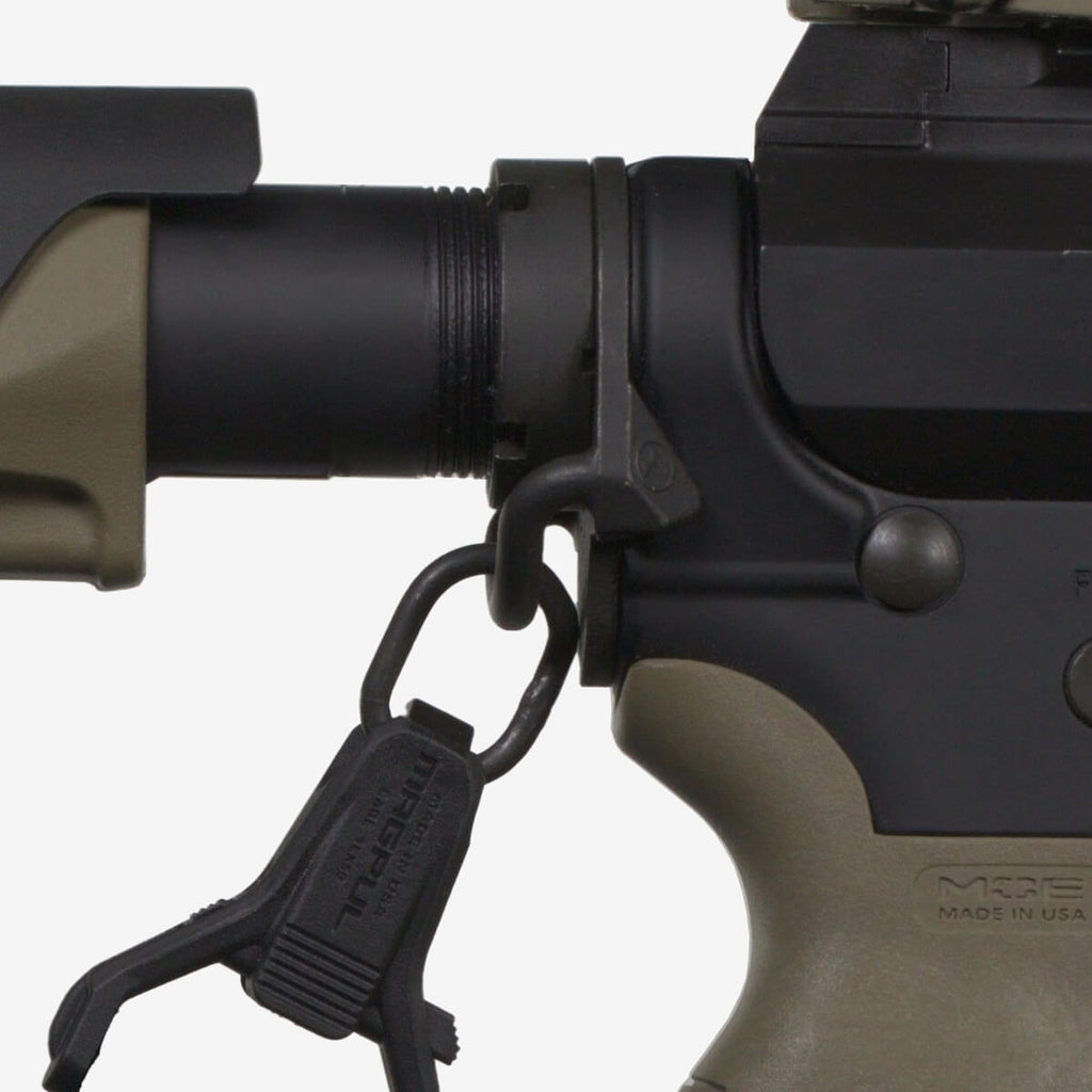 Close-up of a rifle with a black sling attached on a white background