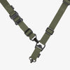 Green tactical sling with black hardware on a white background
