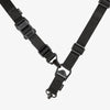 Black tactical sling strap on a white background