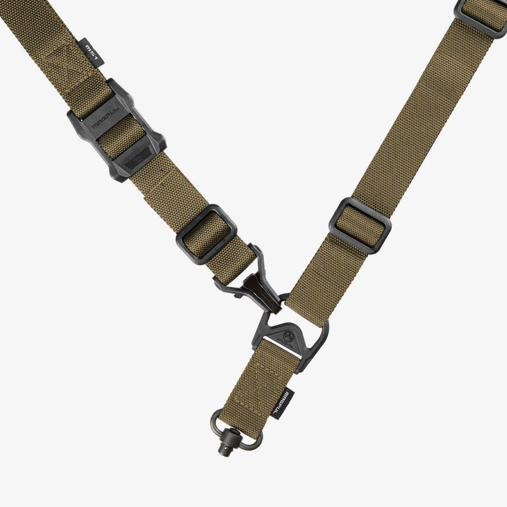 Brown tactical strap with black hardware on a white background