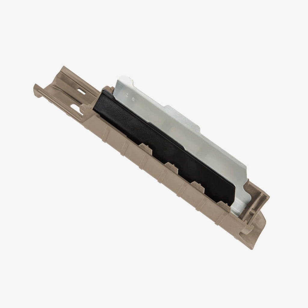 Mechanical keyboard keycap with black rubber dome on a beige plastic frame against a white background