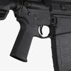 Close-up of a black rifle with visible branding on a white background