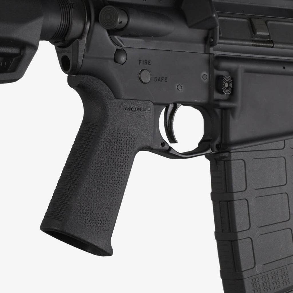 Close-up of a black rifle with visible branding on a white background