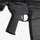 Close-up of a black rifle with visible branding on a white background