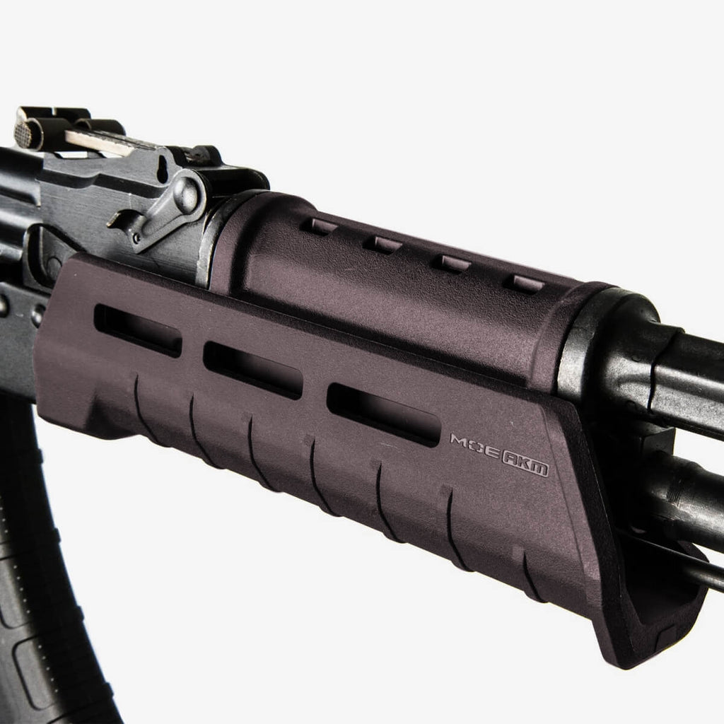 Close-up of a rifle with a MLOK rail on a white background