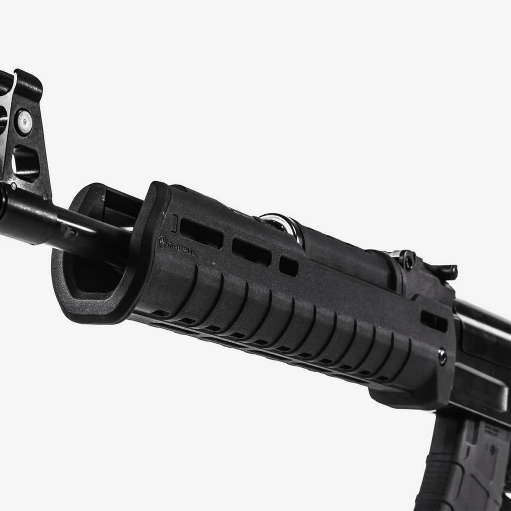 Close-up of a black rifle with a scope on a white background