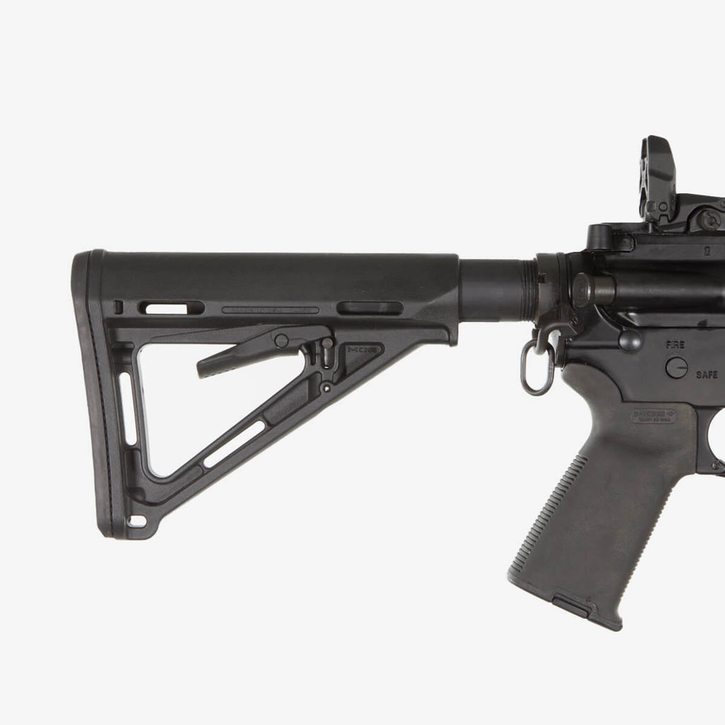 Black rifle with a stock on a white background