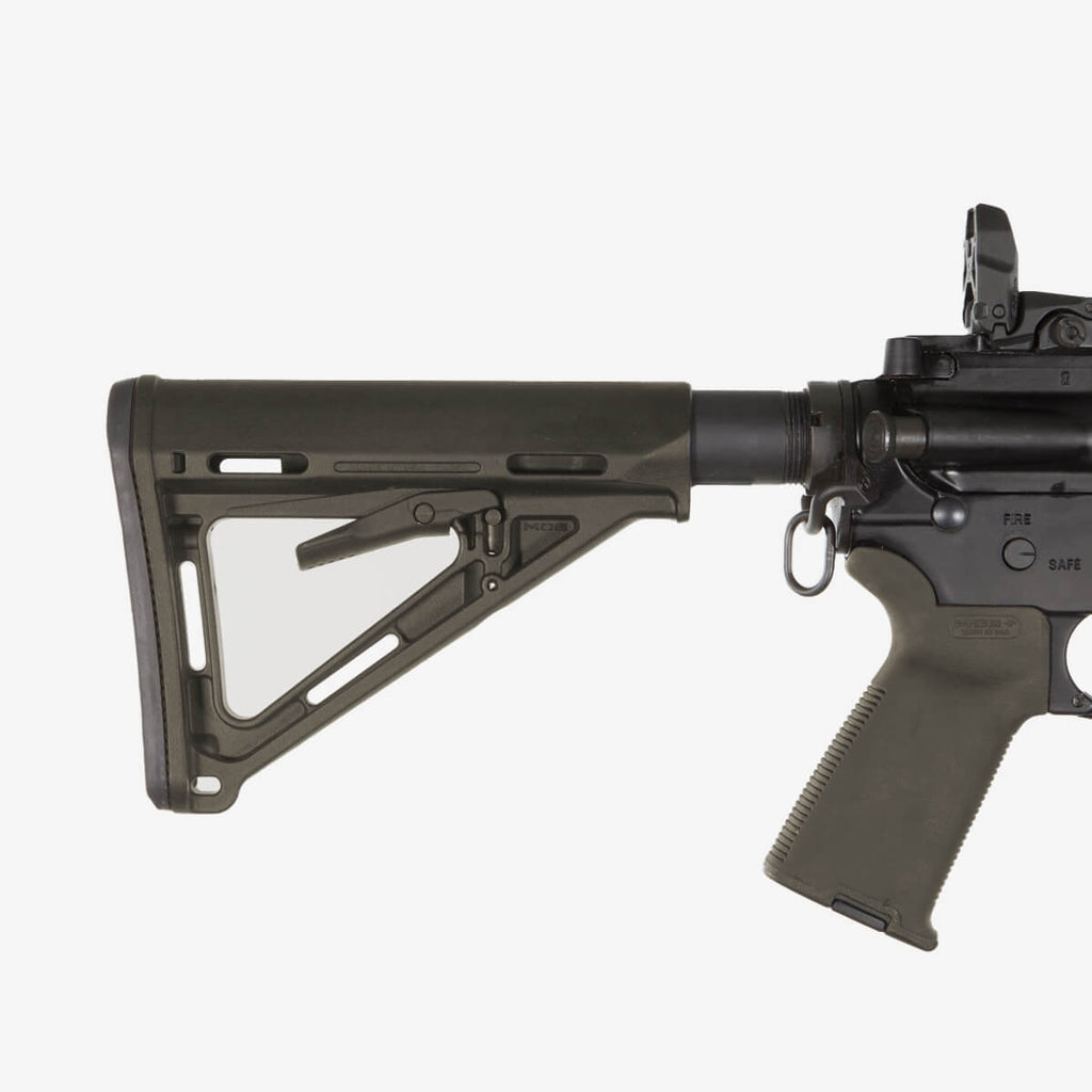 Black rifle with a stock on a white background