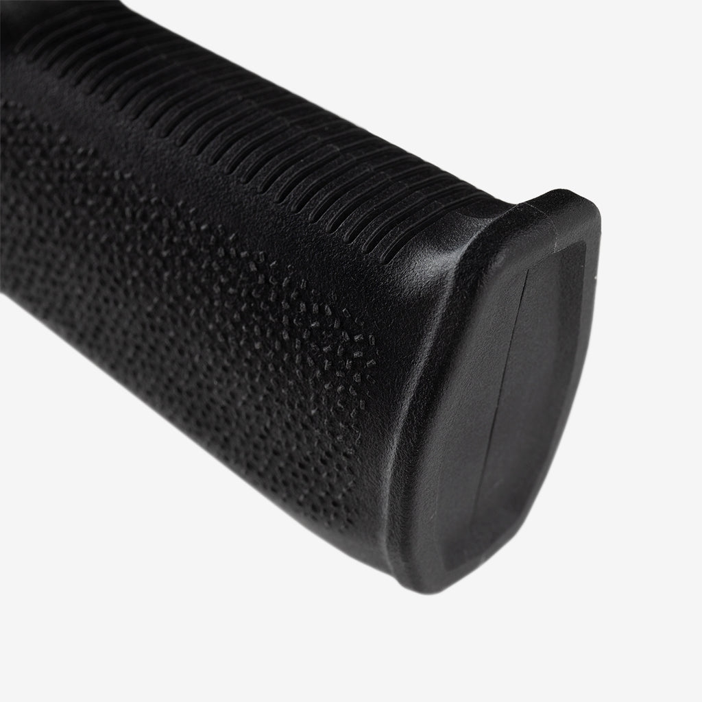 Close-up of a black textured grip on a white background
