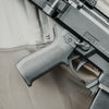 Close-up of a firearm on a beige fabric background