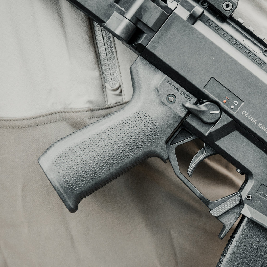 Close-up of a firearm on a beige fabric background