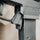 Close-up of a black firearm with a blurred background