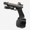 Handgun with flashlight and grip enhancer on a white background