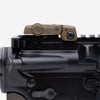 Close-up of a firearm's trigger and safety mechanism on a white background