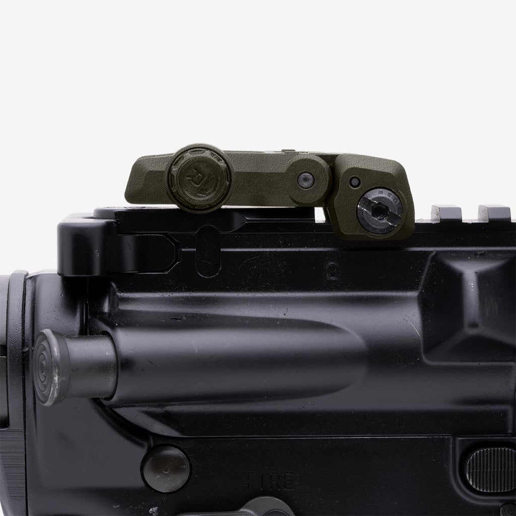 Close-up of a rifle scope on a black background