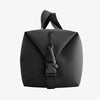 Black backpack with a buckle on a white background