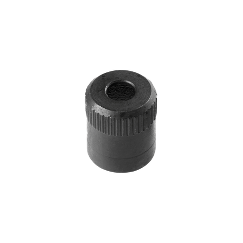 Black cylindrical object with textured surface on a white background