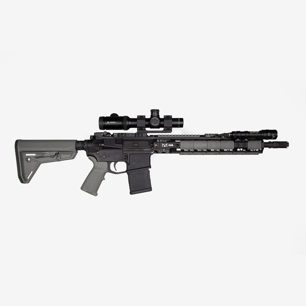 Rifle with scope on a white background