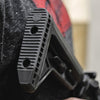 Close-up of a textured gun grip with a blurred background