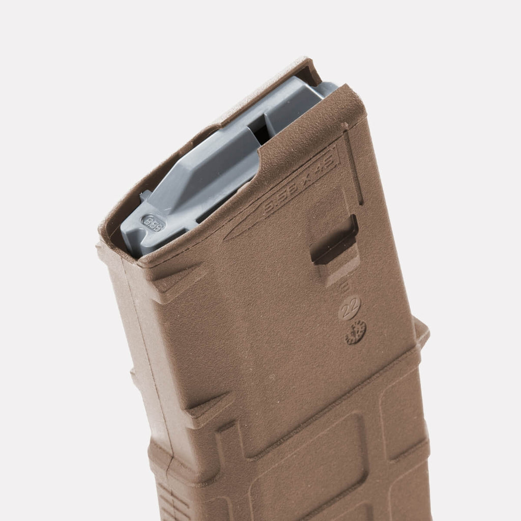 Brown rifle magazine on a white background