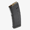 Black rifle magazine with ammunition on a white background