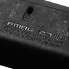 Close-up of a black PMAG magazine with branding text.