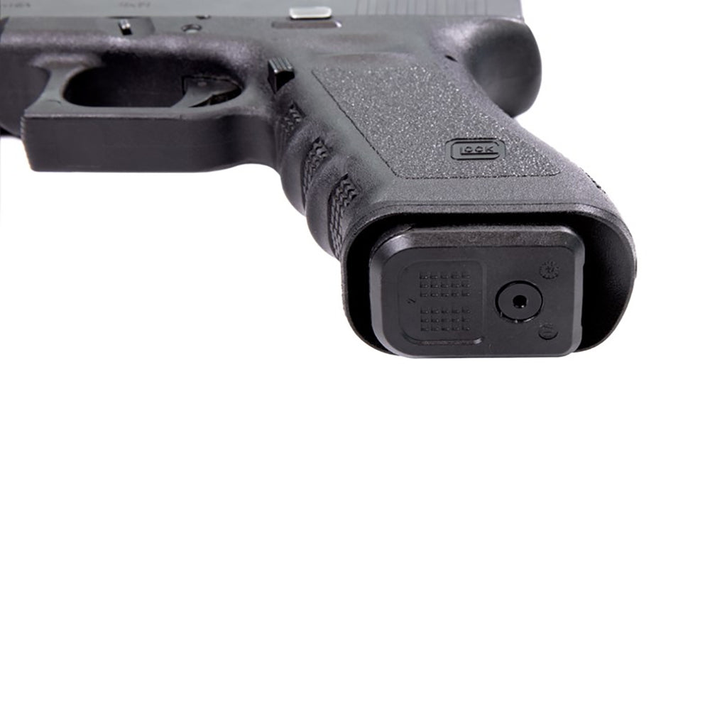 Close-up of a gun with a laser sight attachment on a white background