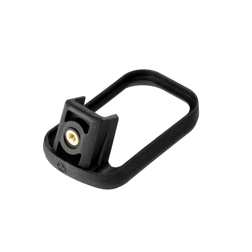 Black metal component with a gold screw on a white background