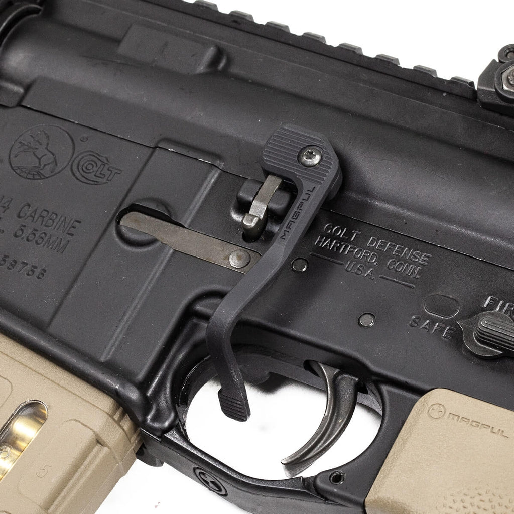 Close-up of a rifle with visible branding on a white background