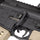 Close-up of a rifle with visible branding on a white background