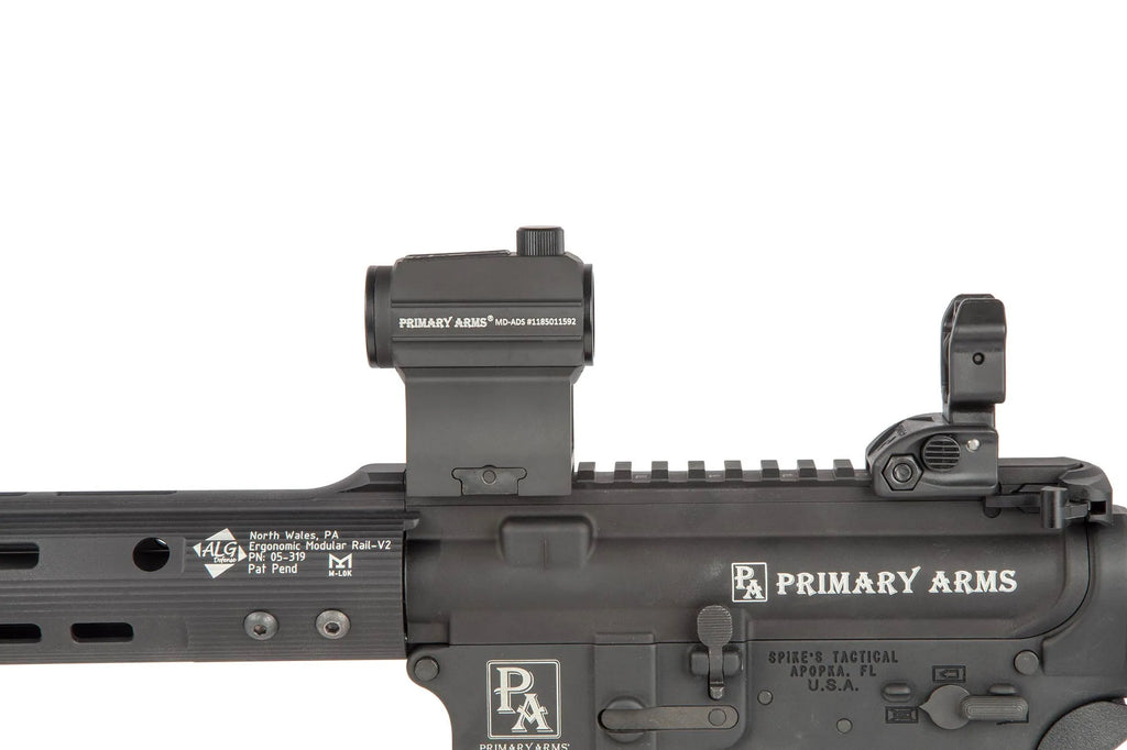 Close-up of a rifle with Primary Arms optics and branding on a white background