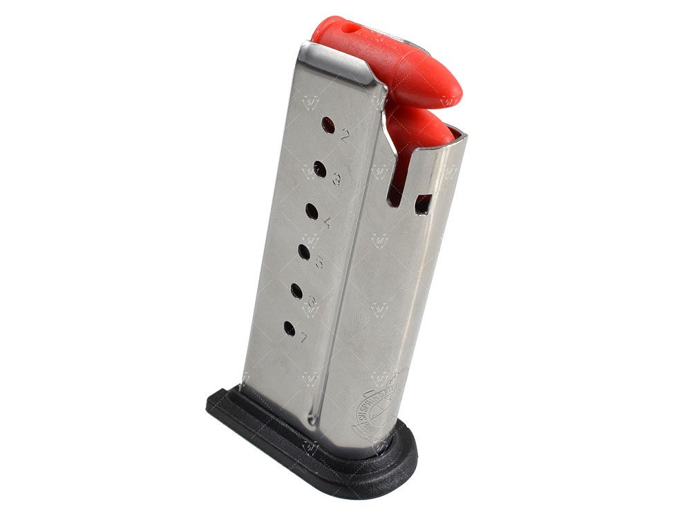 Metal gun magazine with red tip on a white background