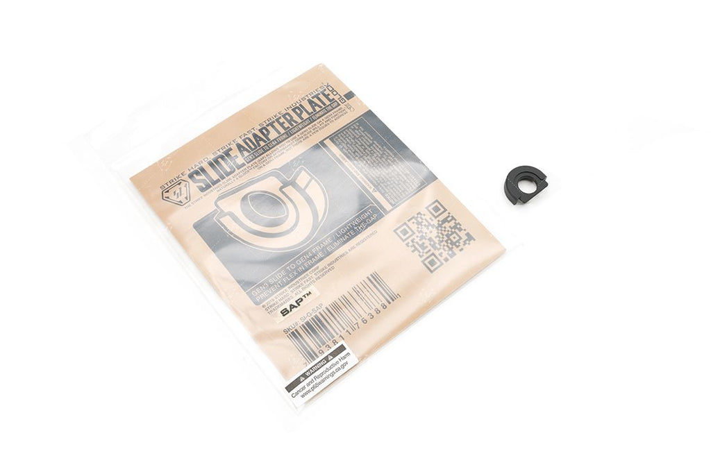 Package of a slide adapter plate with a small black component on a white background