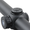 Close-up of a black rifle scope with adjustable knobs on a white background