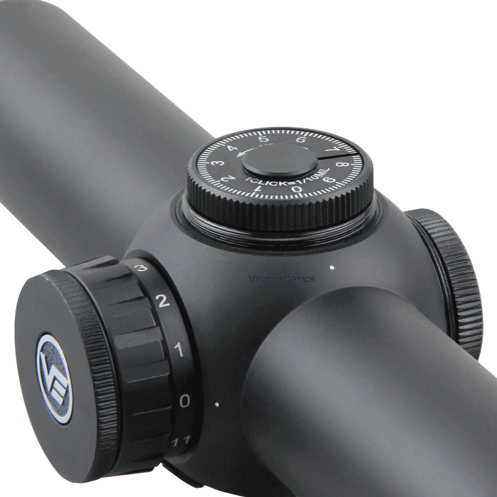 Close-up of a black rifle scope with adjustable knobs on a white background