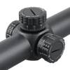 Close-up of a black rifle scope with adjustable dials on a white background