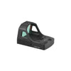 Black reflex sight with green reticle on a white background