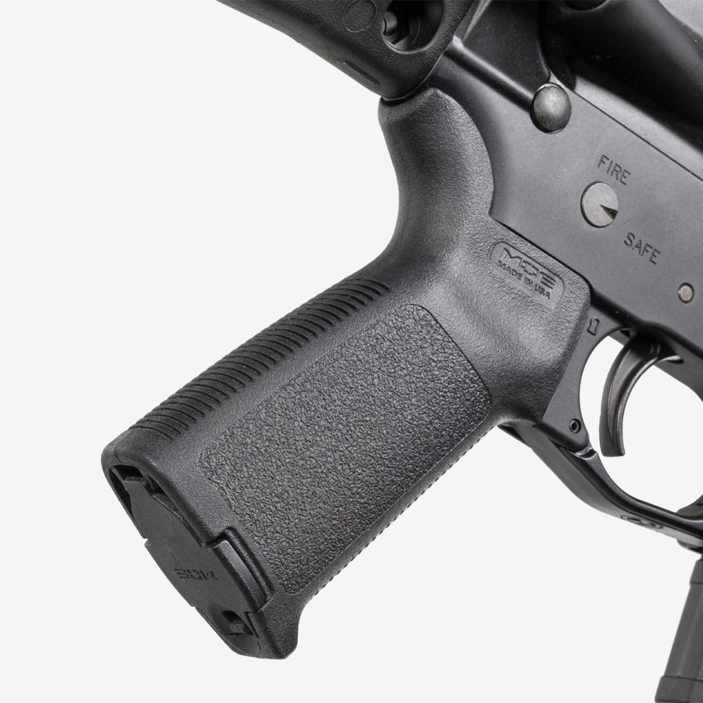 Close-up of a gun's grip and trigger mechanism on a white background