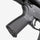 Close-up of a gun's grip and trigger mechanism on a white background